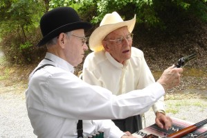 Colonel Allison Checks Rev. Adam Jones' Colt At The Loading Table.